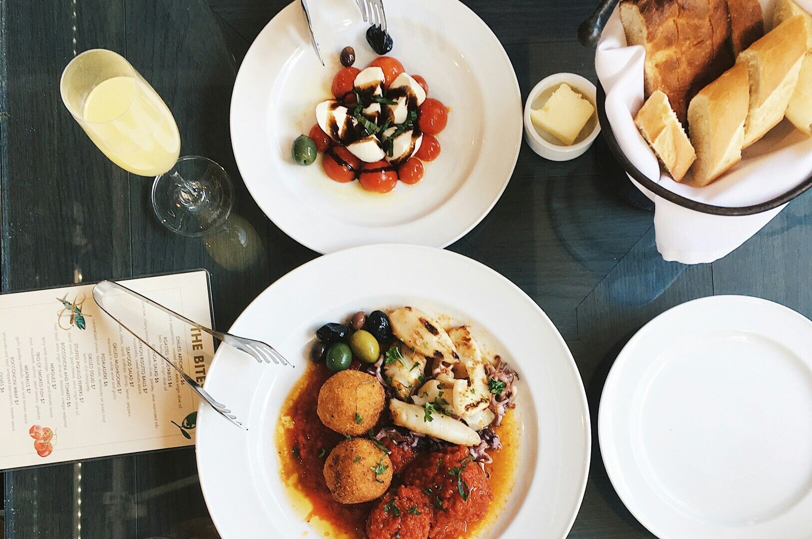 A table set with an assortment of delicious food and drinks, highlighting the art of food photography.