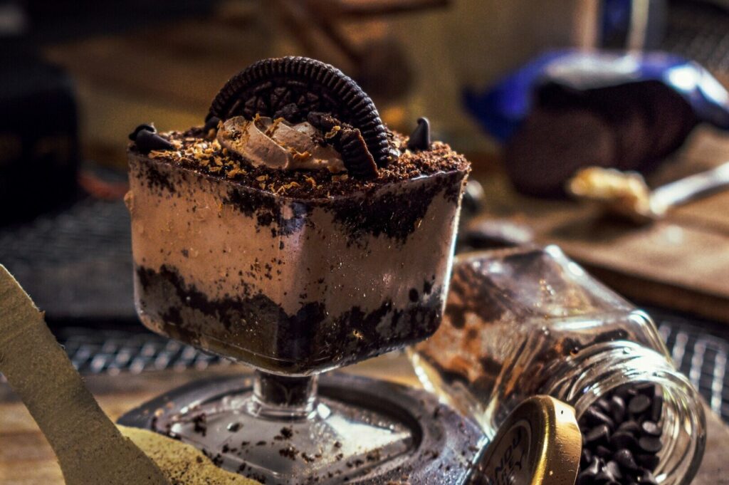 A beautifully styled dessert featuring layers of Oreo cookies and rich chocolate, presented in an elegant dish.