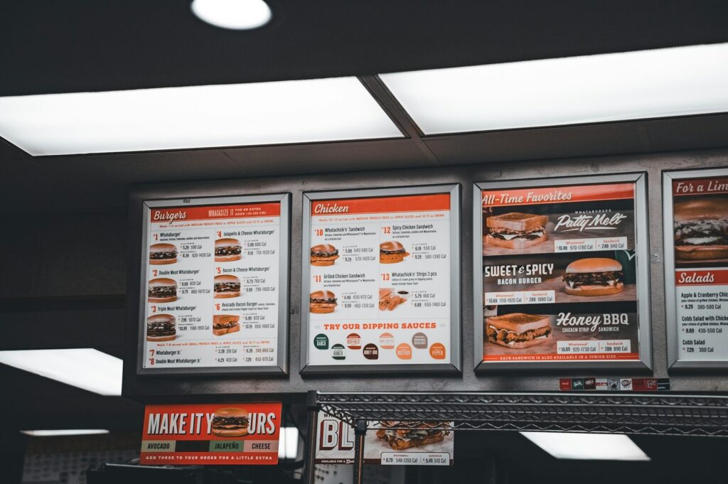 A restaurant menu board showcasing various food items and their prices, designed for an inviting dining experience.