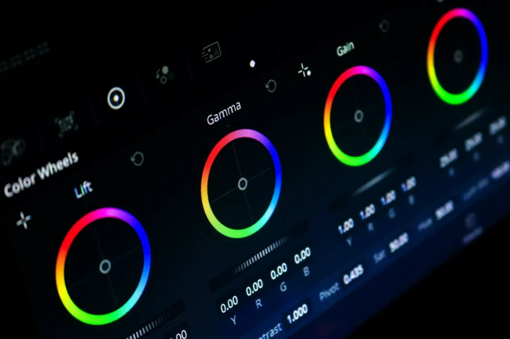 Close-up of a color grading interface showing vibrant color wheels labeled Lift, Gamma, and Gain. The dark background creates a sleek, modern feel.