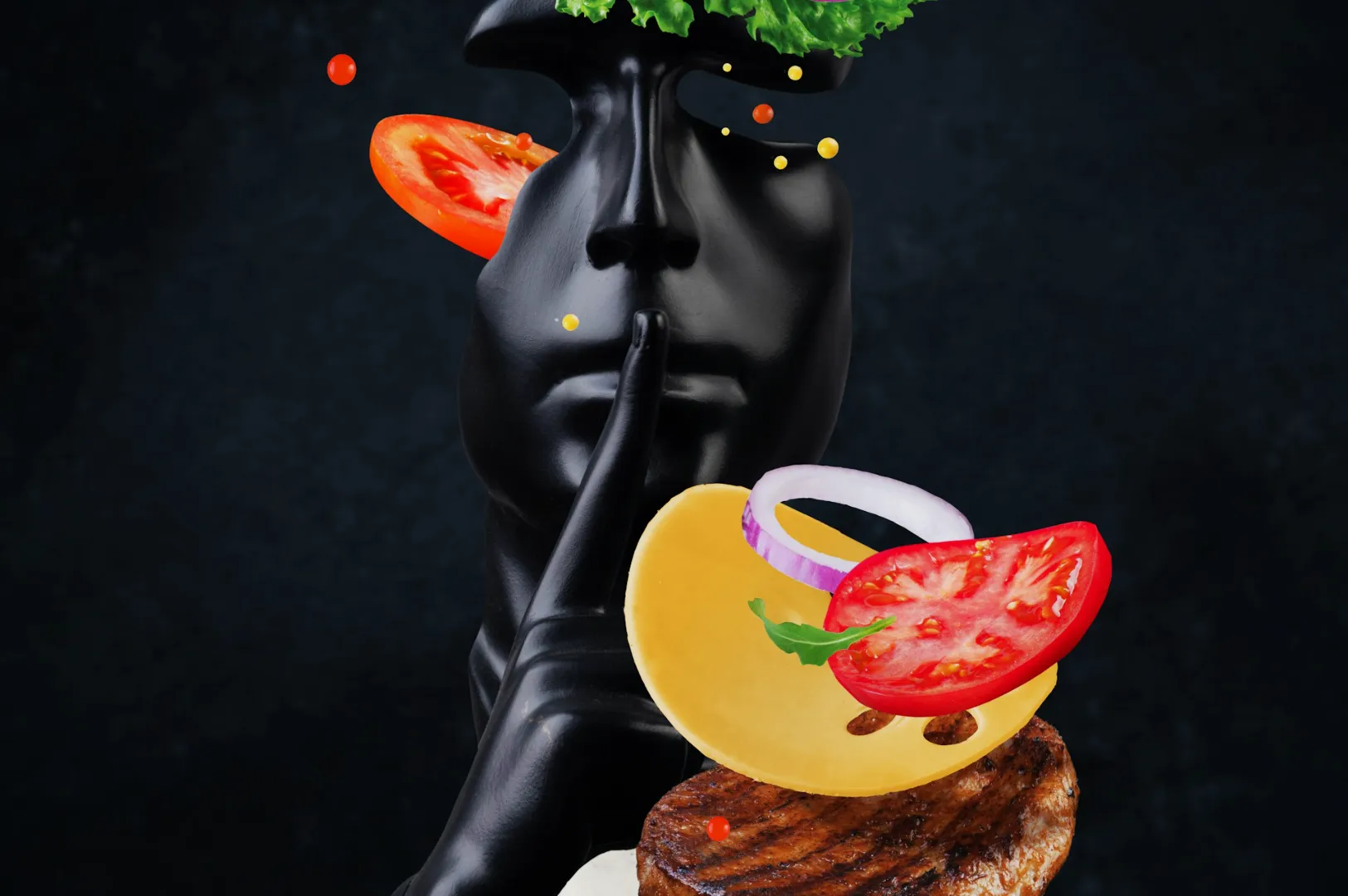 A black sculpture of a face with a finger over its lips, topped with lettuce and tomato slices. Cheese and onion float above a steak slice, evoking culinary creativity.