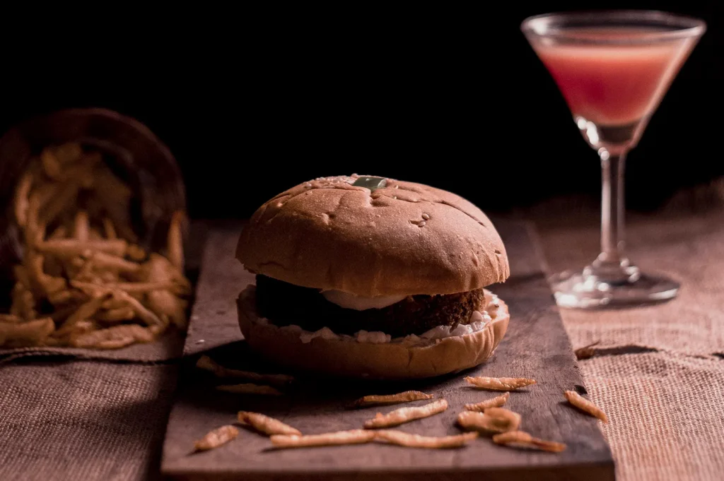 Dark moody food photography of a kids meal burger and fries.